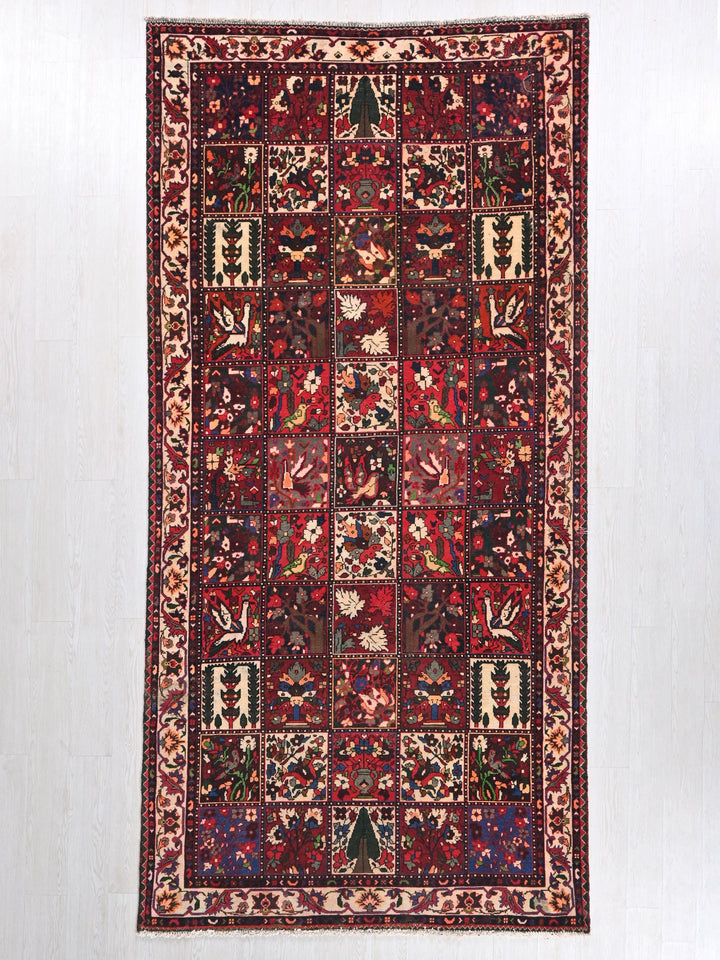 a red rug with a patchwork design on it