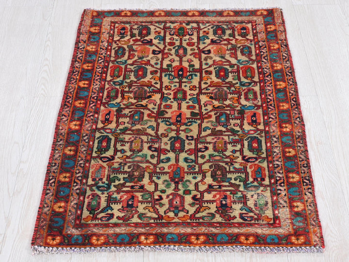 a multicolored rug on a white wooden floor