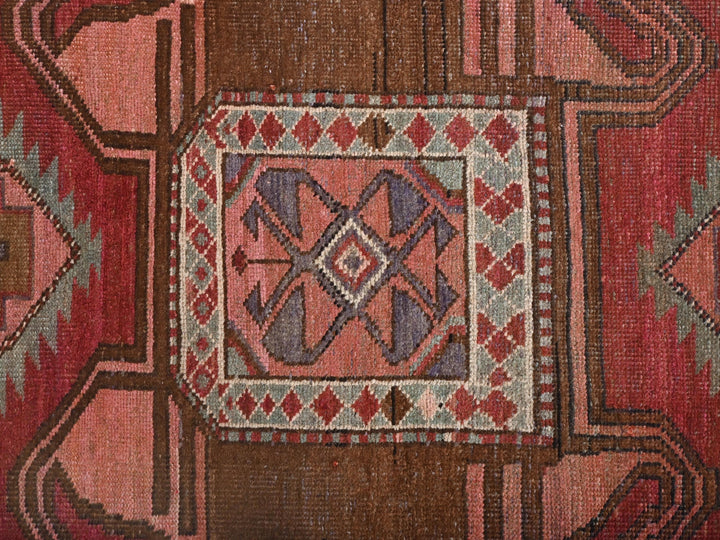 a close up of a rug with a design on it