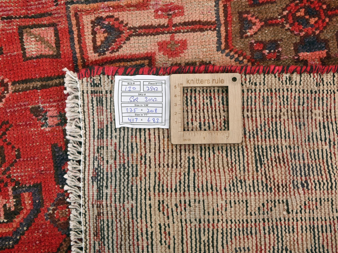 a pile of rugs with a tag on it