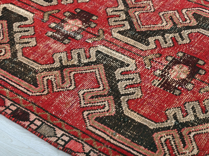 a close up of a rug on a wooden floor