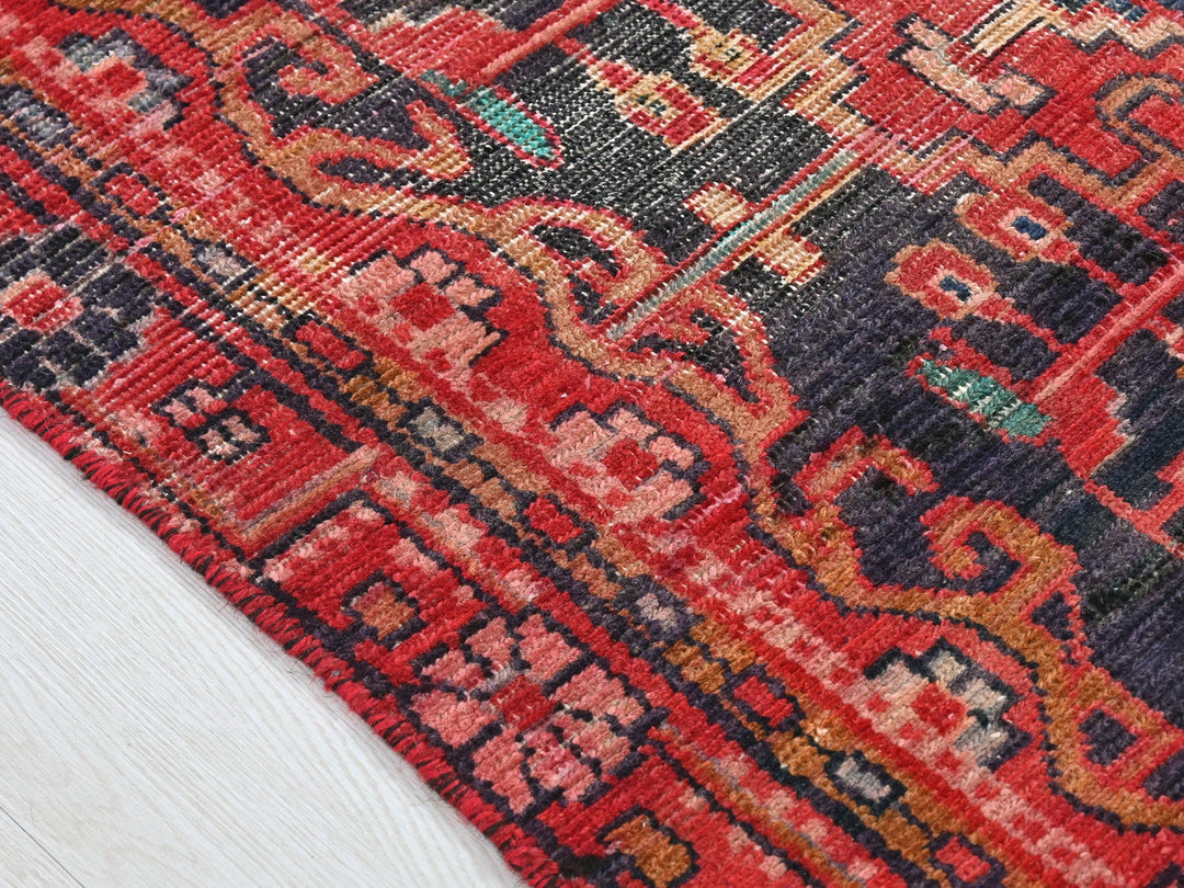 a close up of a rug on a wooden floor