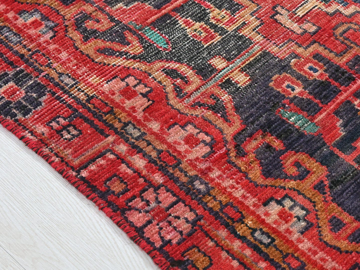 a close up of a rug on a wooden floor