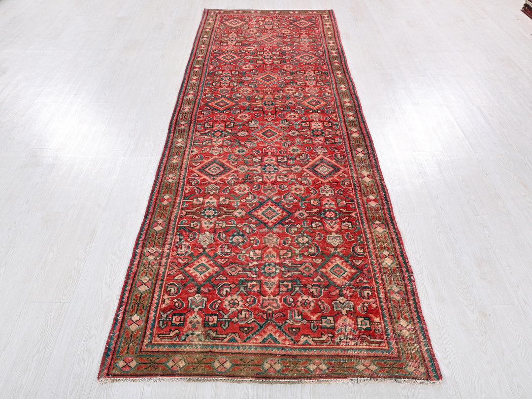 a red rug on a white floor in a room