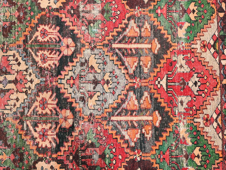 an old rug with a lot of different colors