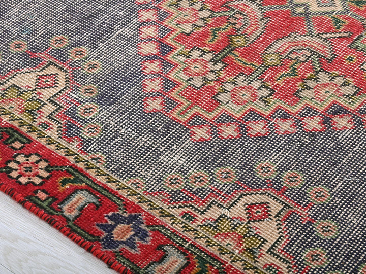a close up of a rug on a wooden floor