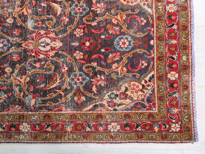 a rug with a floral design on a wooden floor