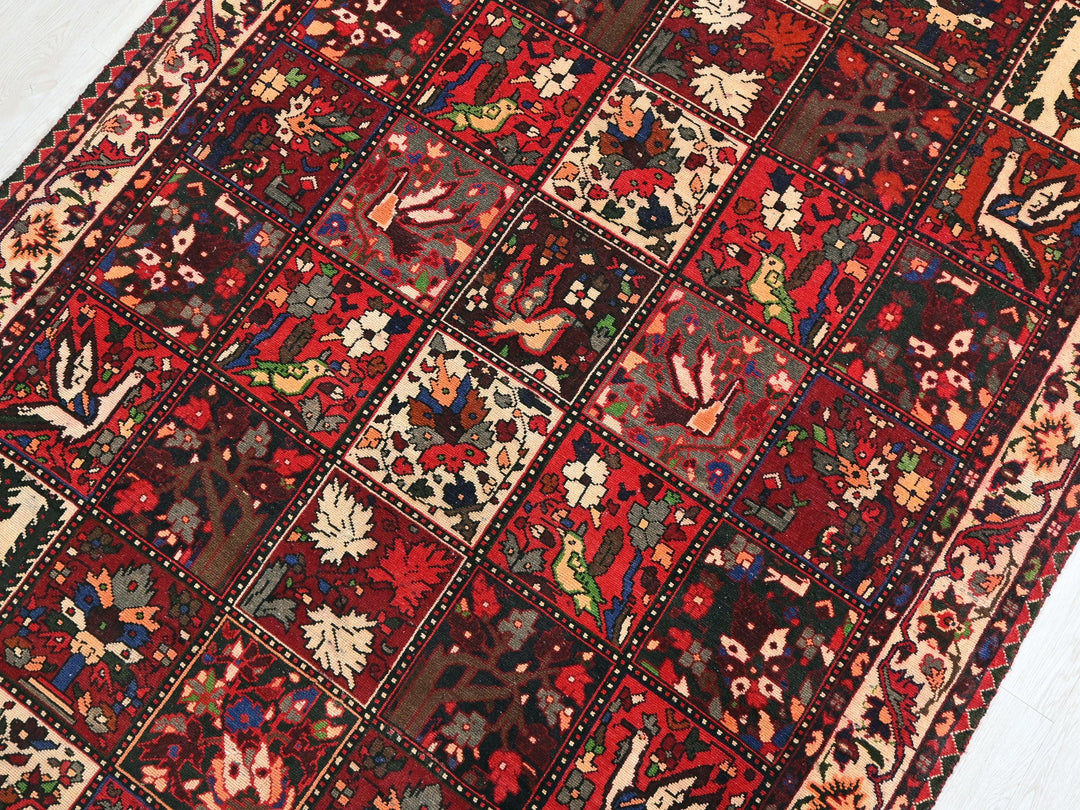 a red rug with many different designs on it