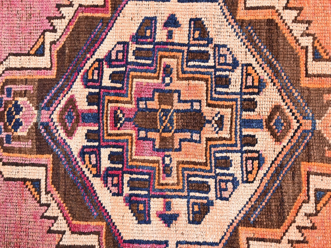 a close up of a rug with a design on it