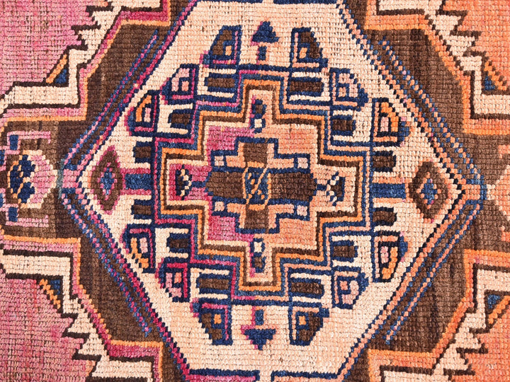 a close up of a rug with a design on it