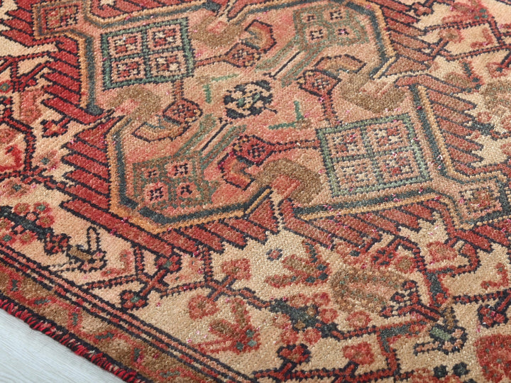 a large oriental rug with a red and blue design