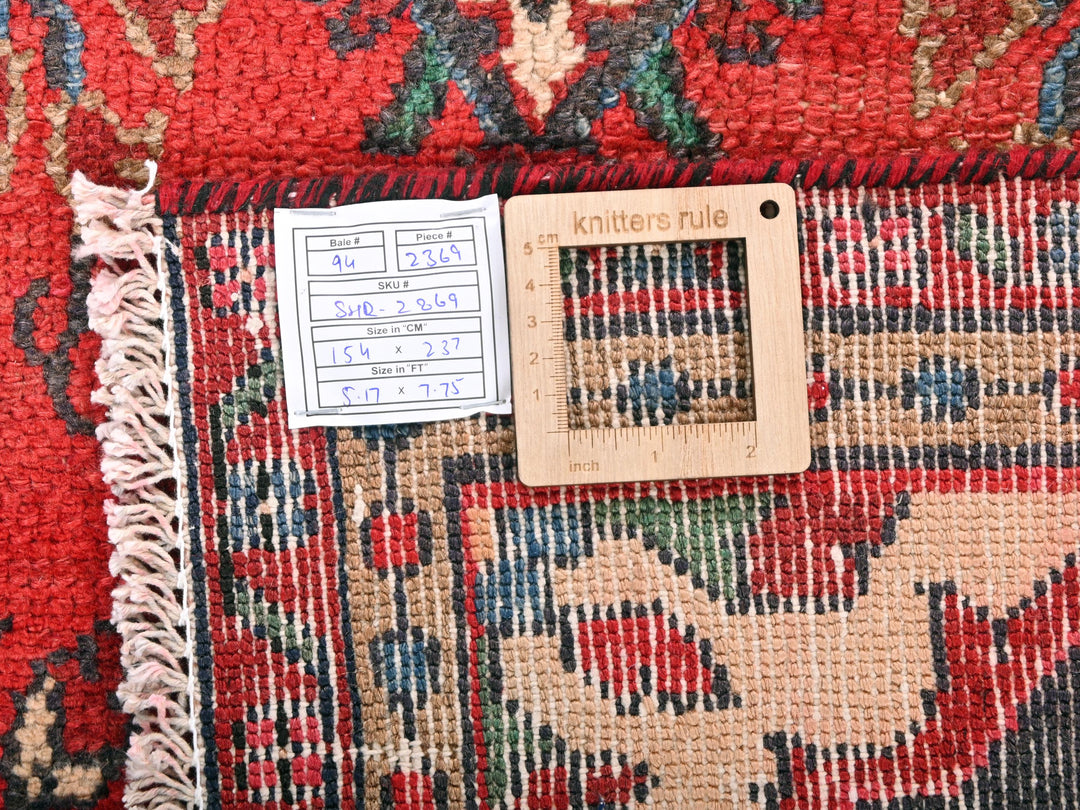 a piece of wood sitting on top of a rug