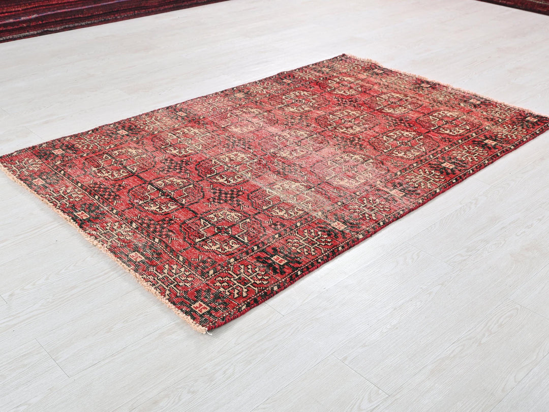 a red rug on a white floor in a room