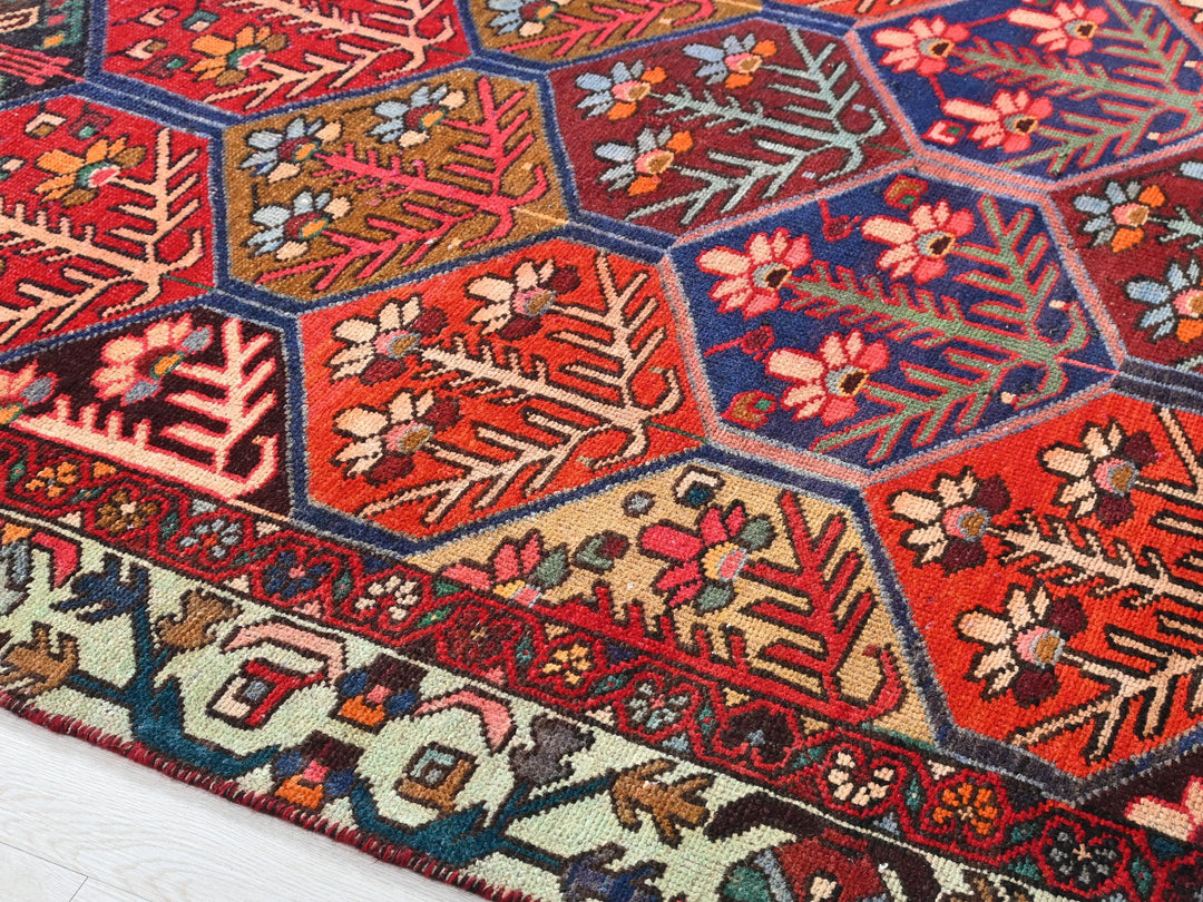 a colorful oriental rug with many different patterns