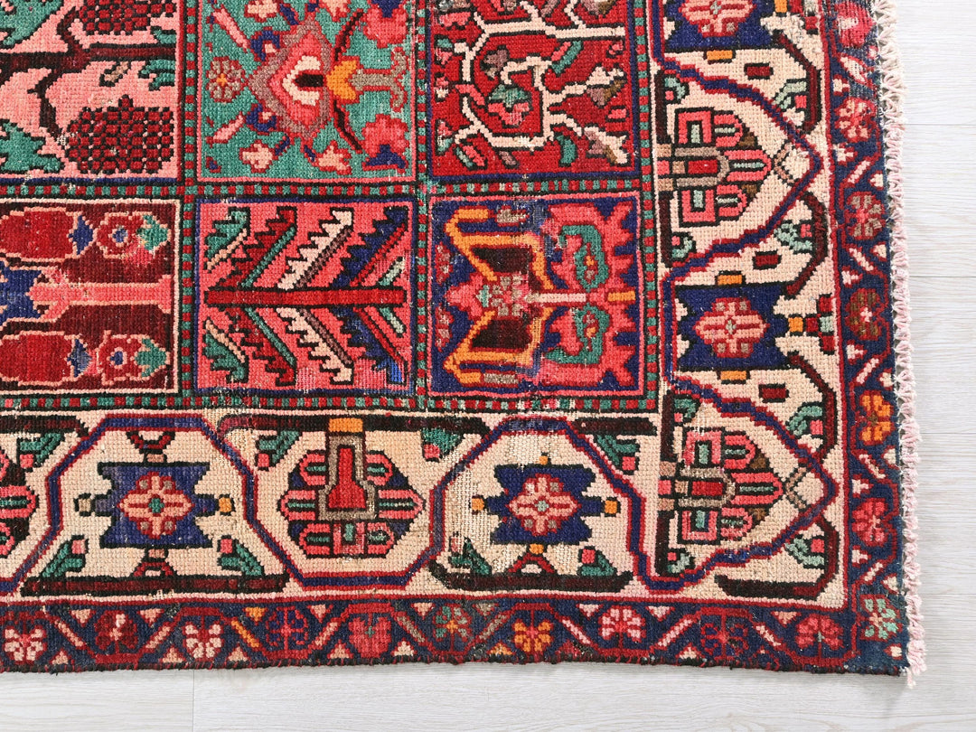 a multicolored rug on a white surface