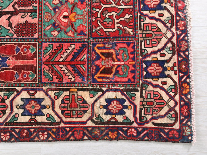 a multicolored rug on a white surface