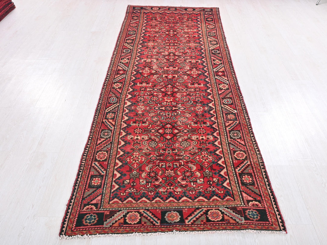 a red rug on a white floor in a room