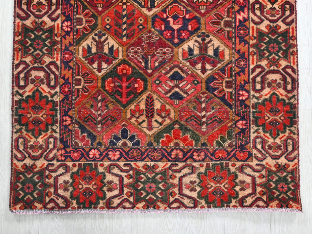 a red and blue rug on a white floor