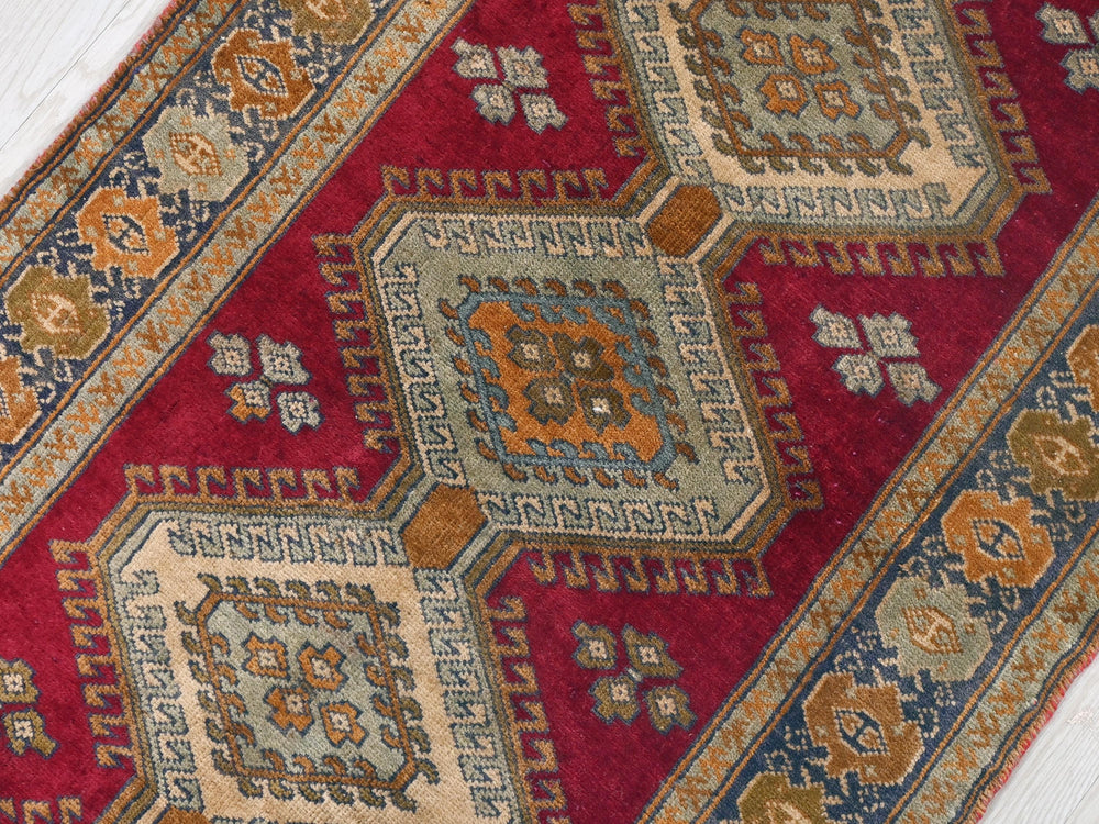 a close up of a rug on a wooden floor