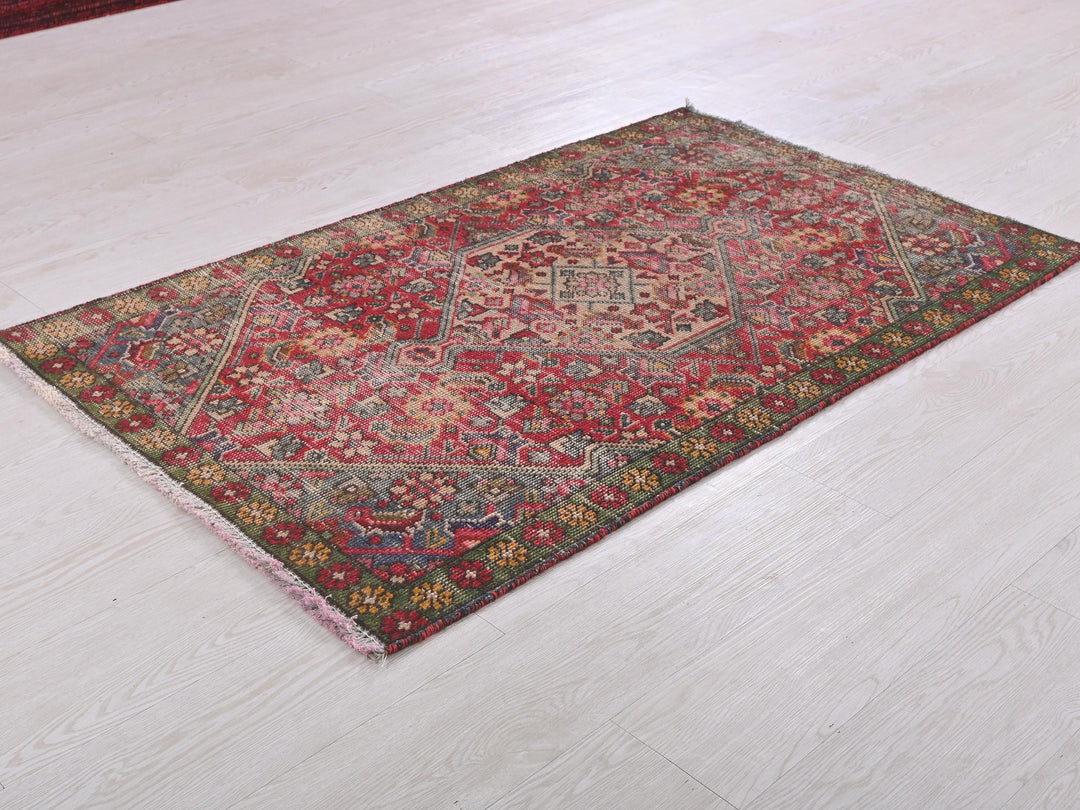 a red rug on a white floor in a room