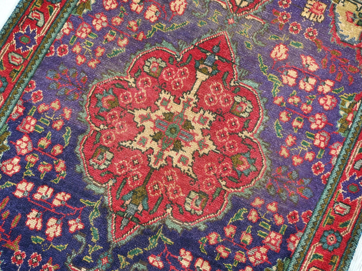 a colorful rug with a flower design on it