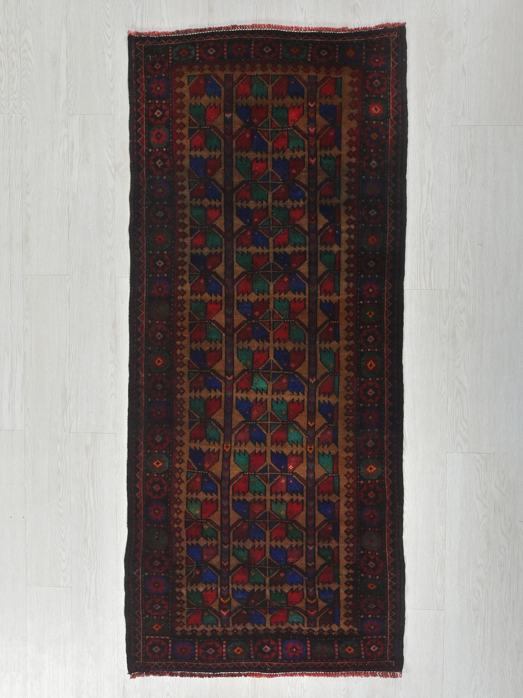 a rug hanging on a wall in a room