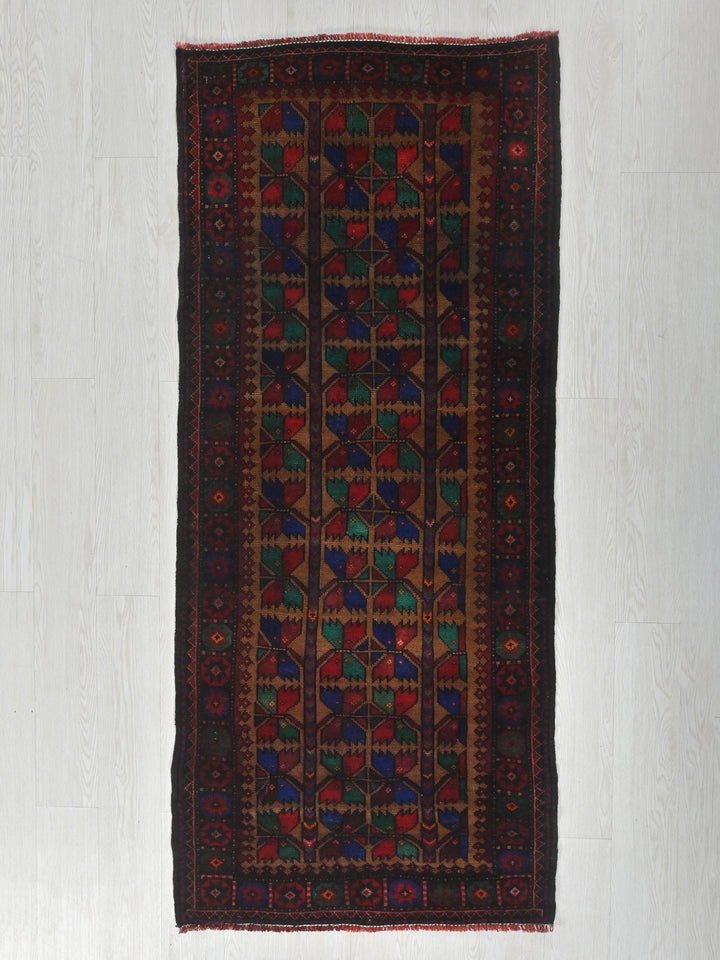 a rug hanging on a wall in a room