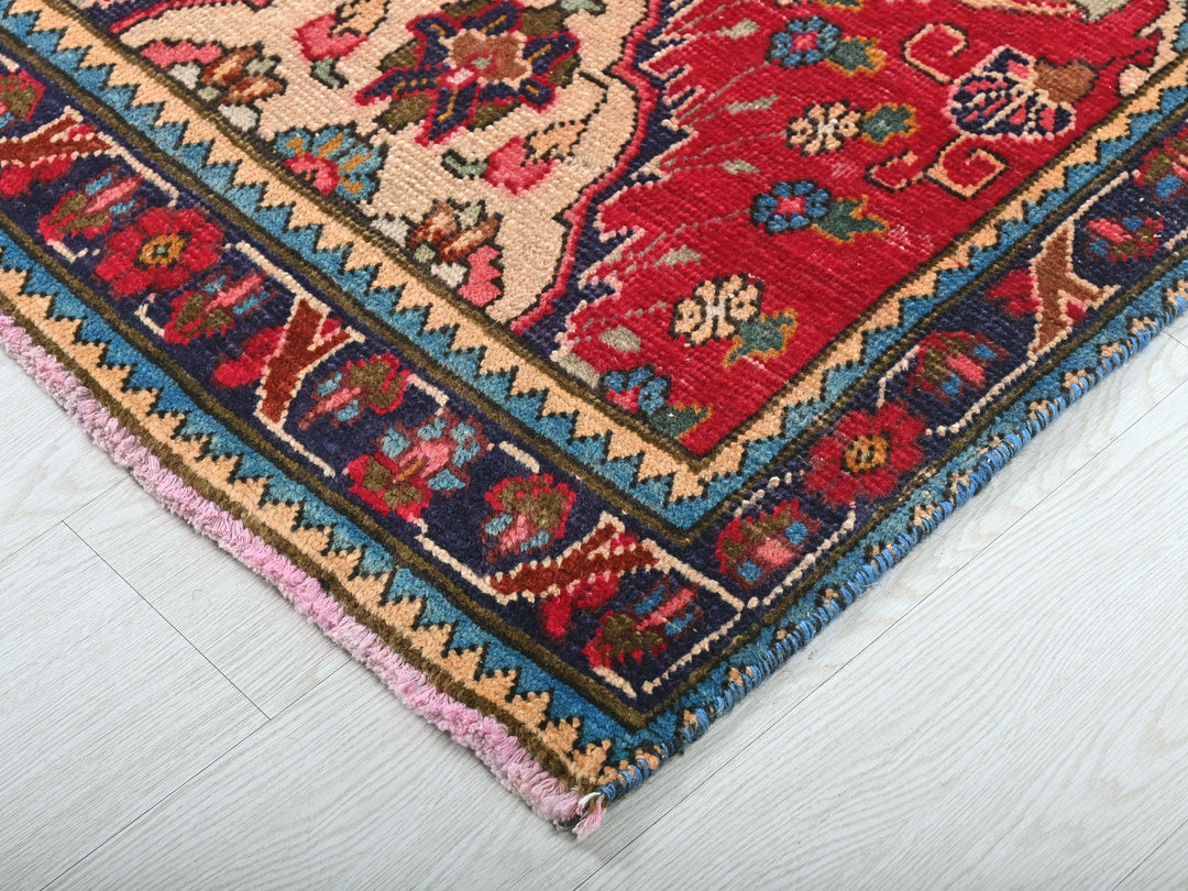 a colorful oriental rug on a white wooden floor