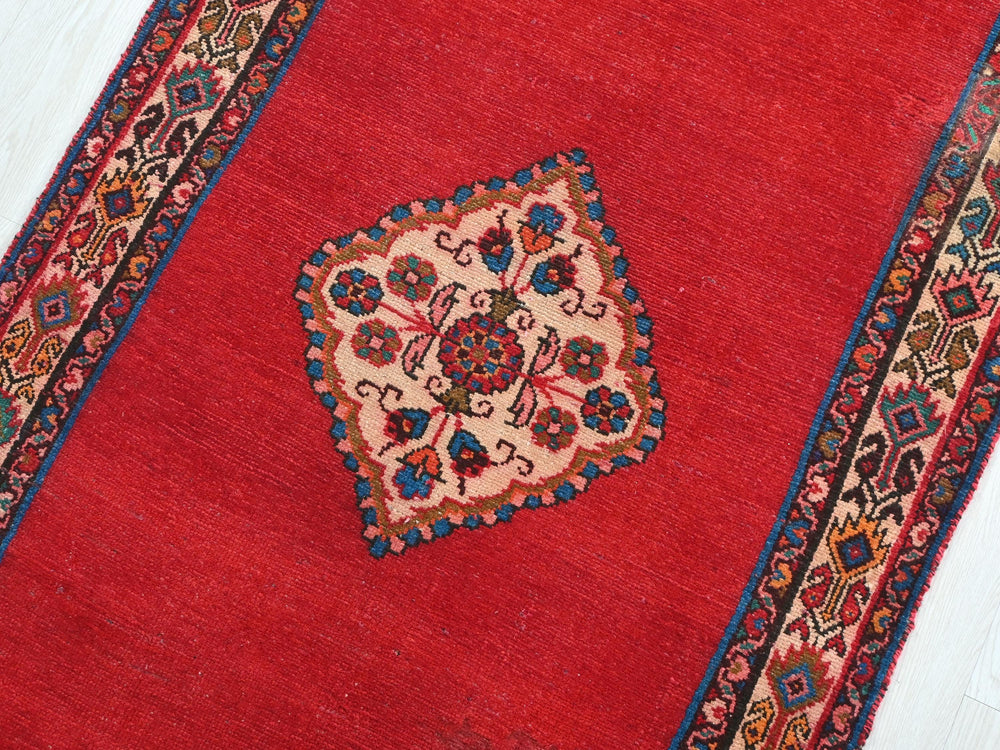 a close up of a rug on a wooden floor