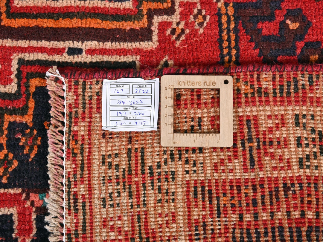 a piece of wood sitting on top of a rug