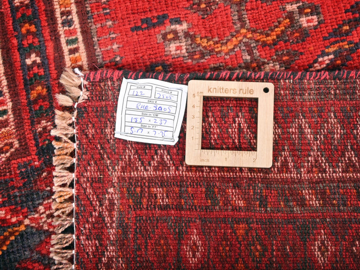 a piece of wood sitting on top of a rug