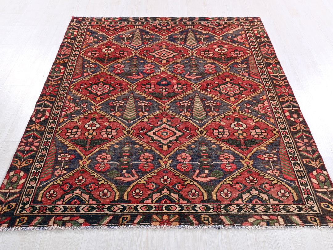 a red and blue rug on a white floor