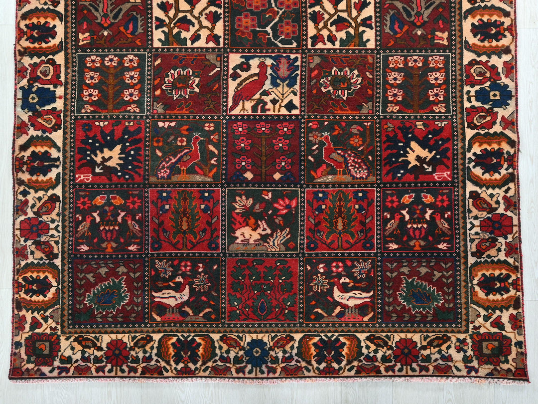 a red rug with a patchwork design on it