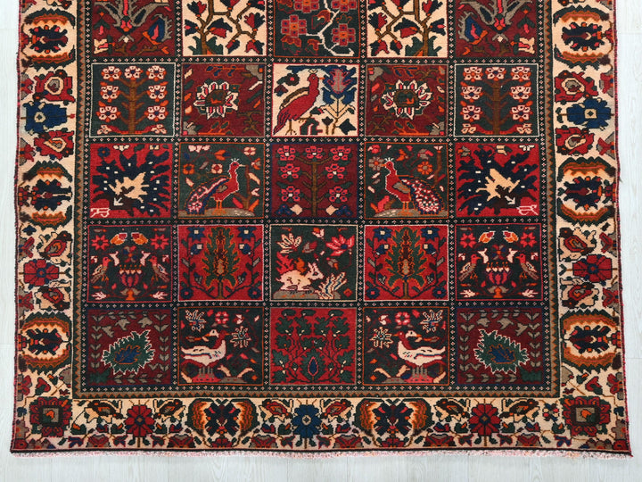 a red rug with a patchwork design on it