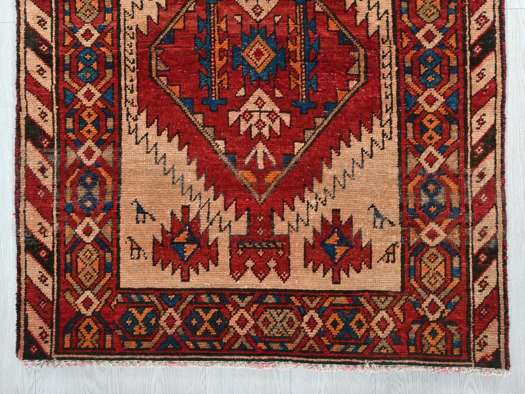 a rug with a red and blue design on it