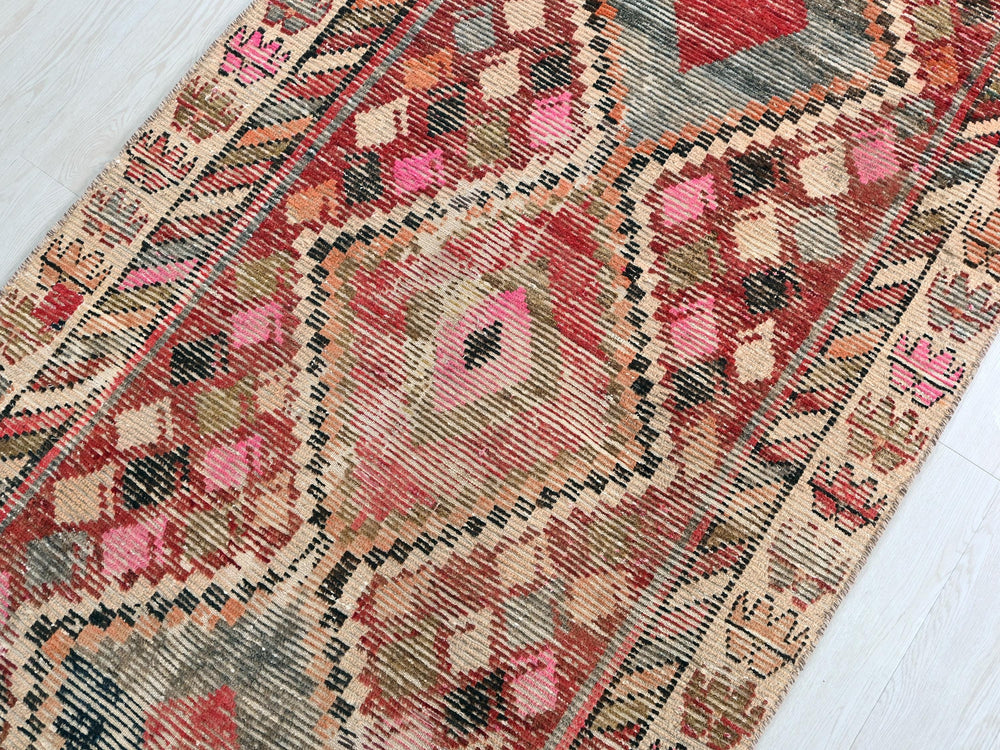 an old rug is laying on the floor