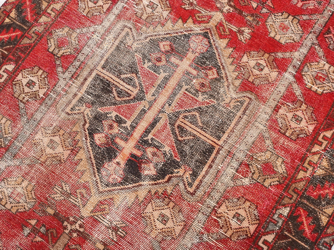 a close up of a red oriental rug