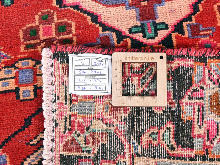 a close up of a rug with a ruler on it