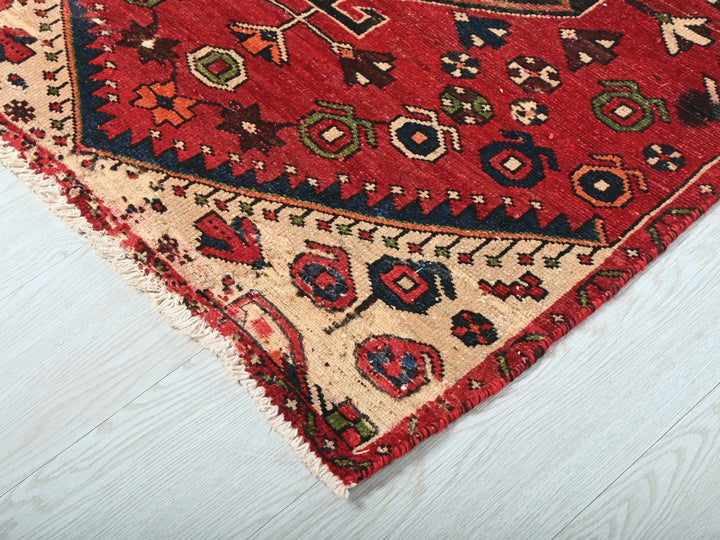 a close up of a rug on a wooden floor