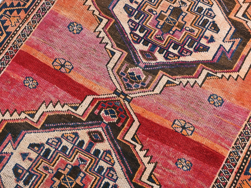 a colorful oriental rug with geometric designs