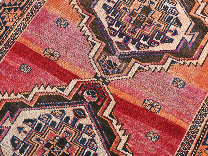 a colorful oriental rug with geometric designs