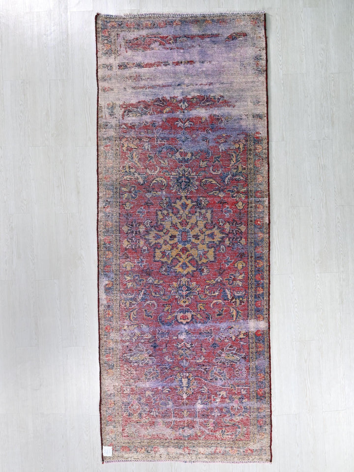 a rug hanging on a wall in a room