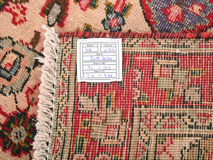 a close up of a rug with a tag on it