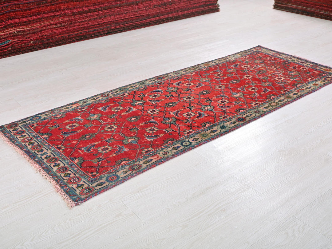 a red rug is laying on the floor