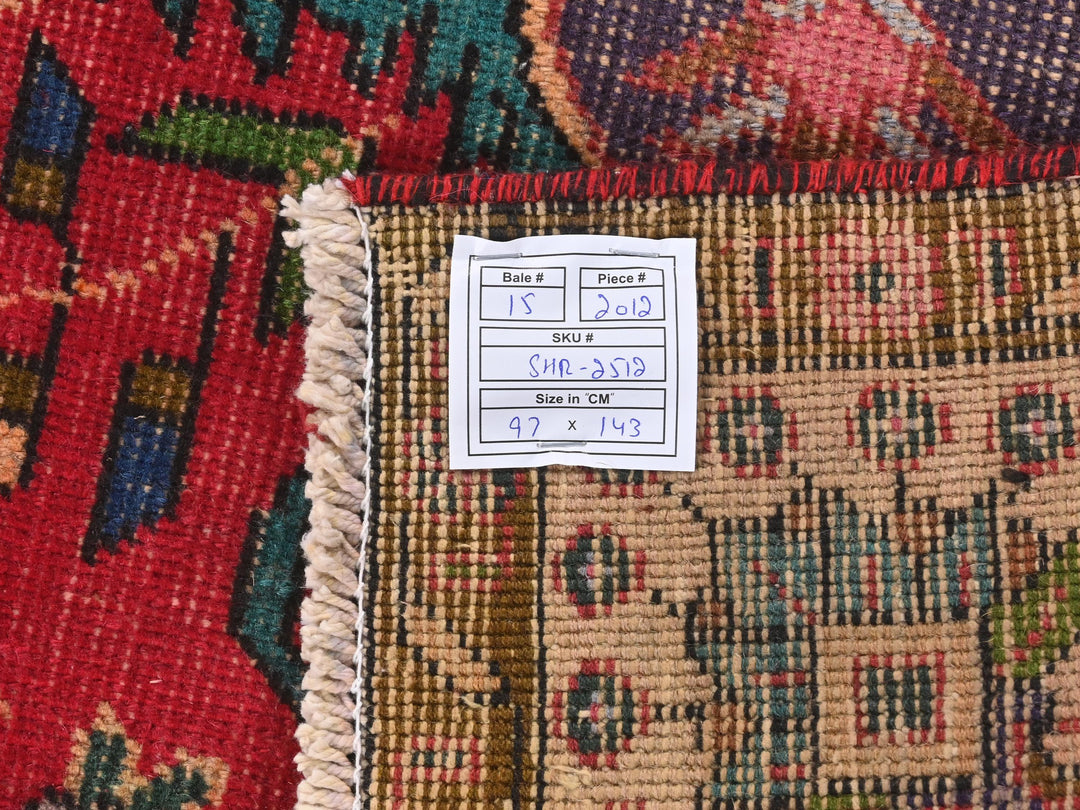 a pile of rugs with a price label on them