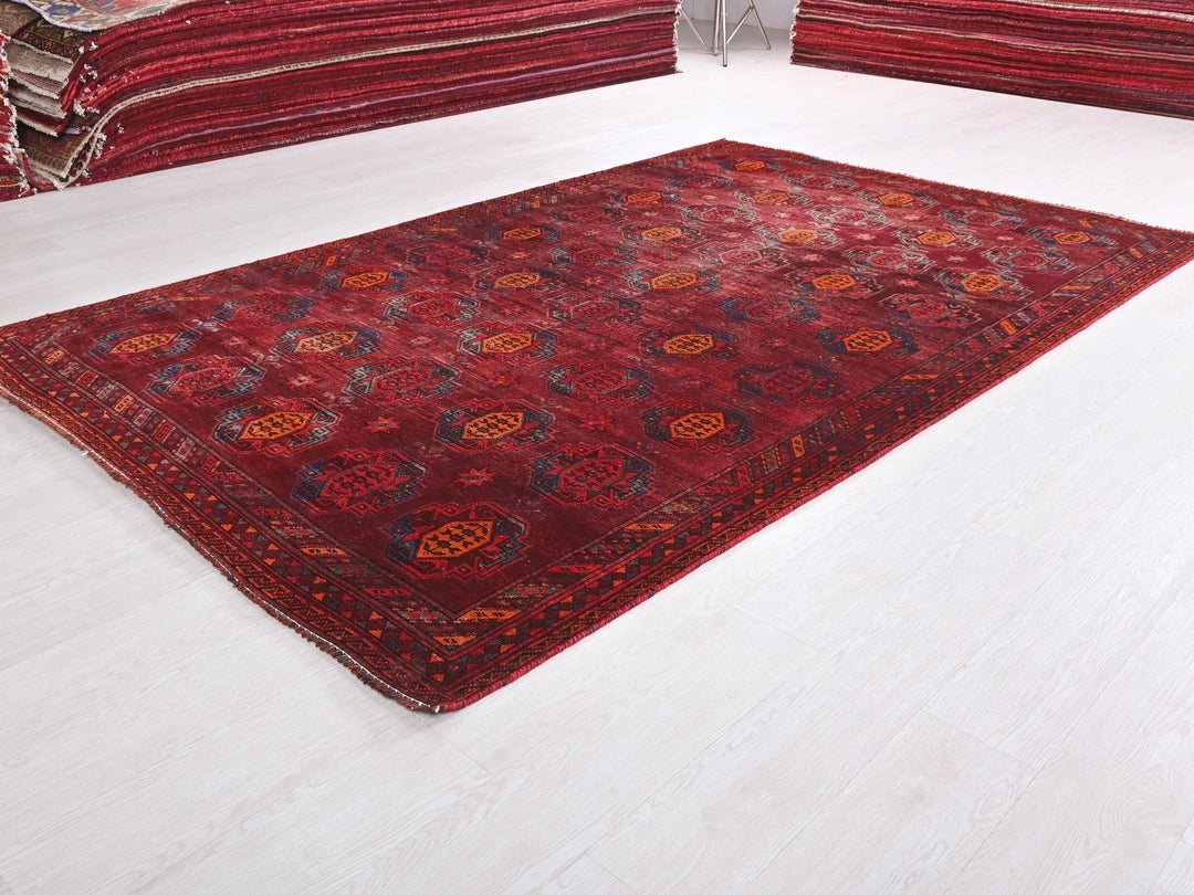 a red rug on a white floor in a room