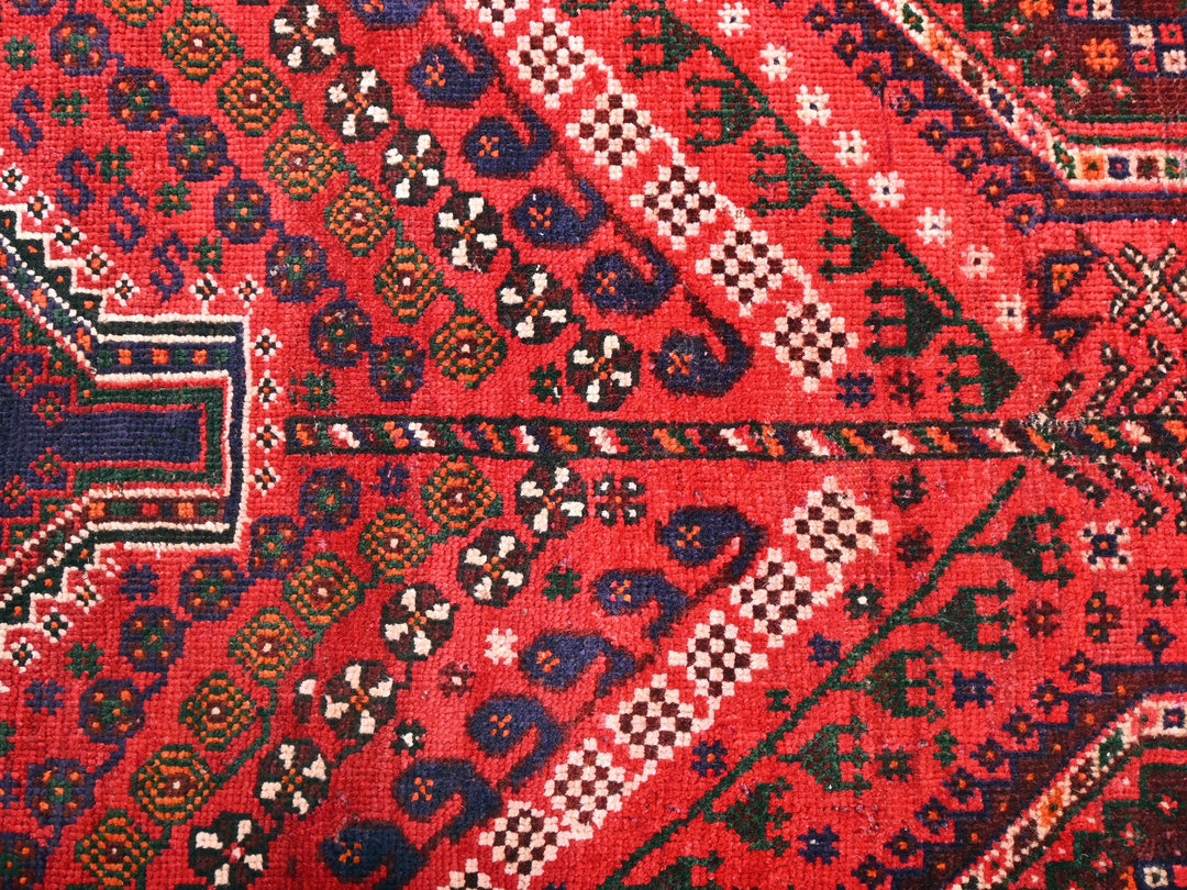 a close up of a rug with a cross on it