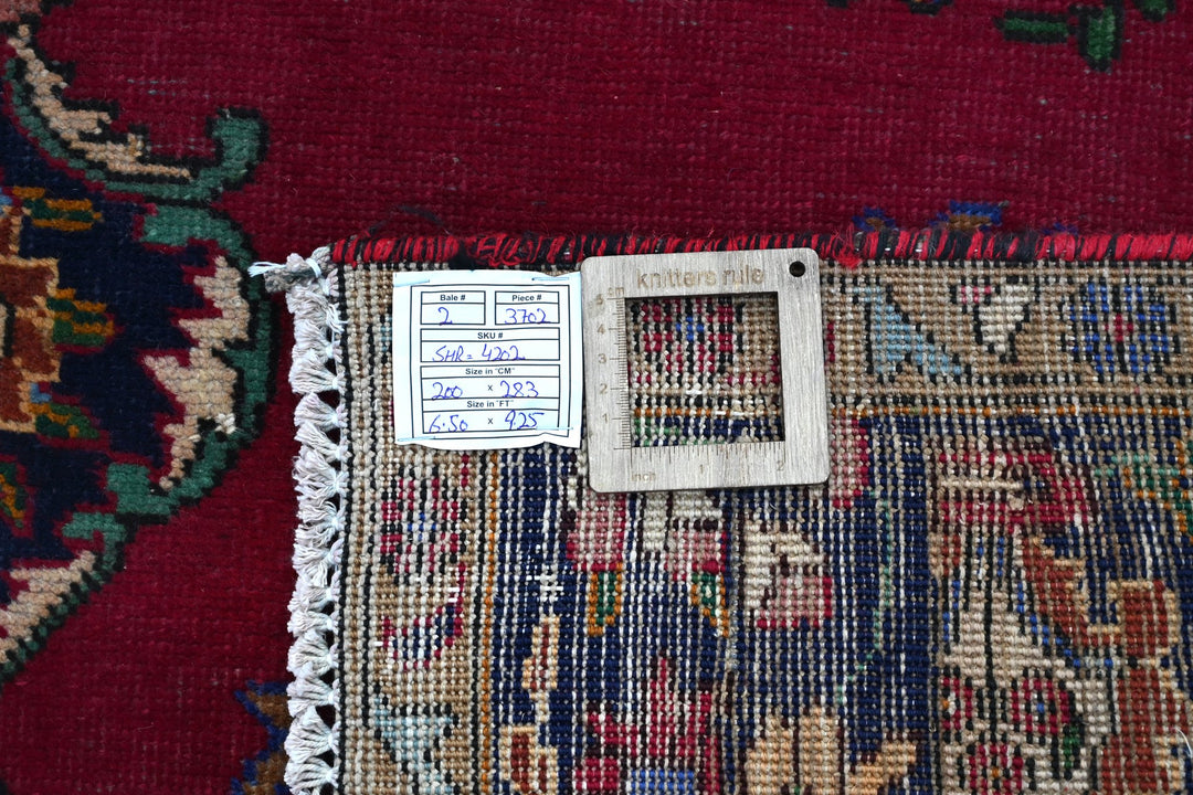 red Large rug 6' 7" x 9' 3"