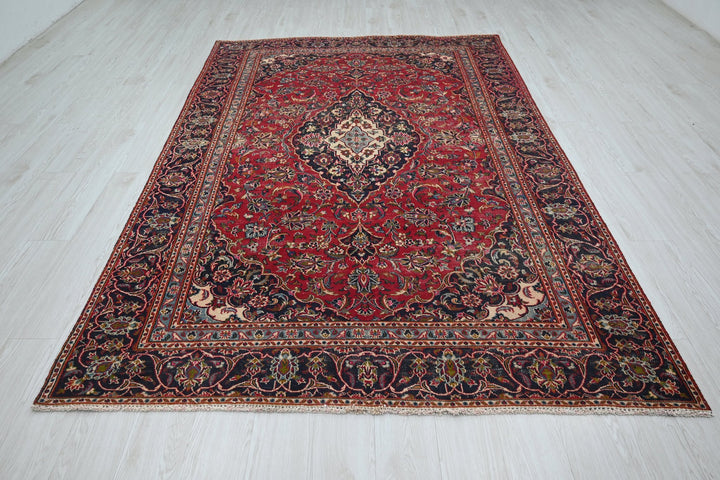 red Medium rug 5' 10" x 9' 0"
