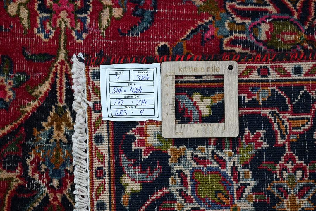 red Medium rug 5' 10" x 9' 0"